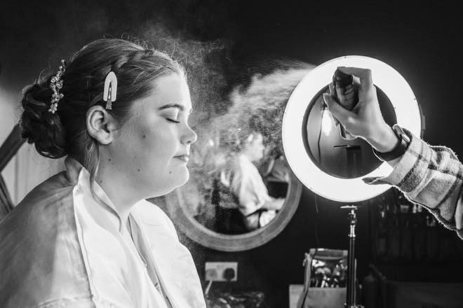 Setting spray finishing a bridal makeup look